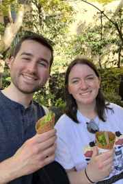 Enjoying matcha ice cream in Kyoto's sunny outdoors.