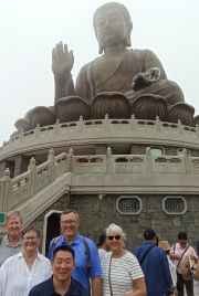 A group gathers beneath the serene gaze of Hong Kong's Buddha.