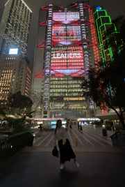 Night lights of Hong Kong create a striking urban backdrop.