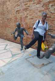 A playful moment with lively bronze statues in Singapore.