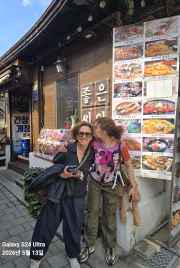 Smiles shared while discovering authentic Korean flavors together.