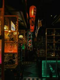 Karaoke booth featuring vintage decor, dim lighting, and a cozy retro atmosphere. Image by Nathan J Hilton on Pexels.