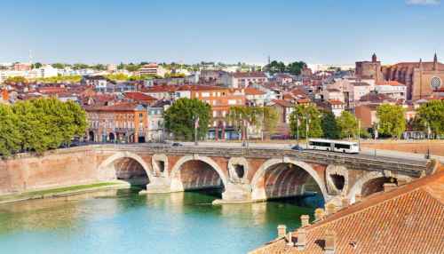 View of Pont Neuf bridge over the Garonne River in Toulouse, France.