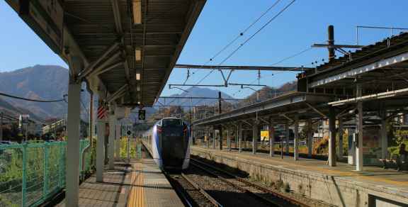 A train pulling into Kyoto Station on a crisp morning, Mount Hiei in the background Photo by Dhruv Patel on Unsplash