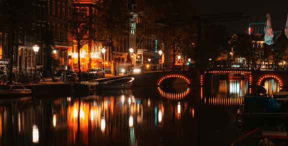 Amsterdam at Night: Cozy Canals, Ferries, and Late Bites  Photo by Raluca Dumitrache on Unsplash