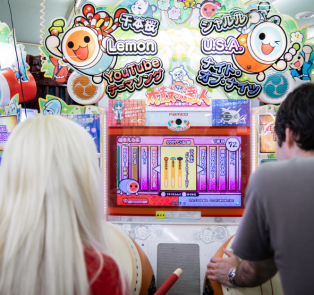 Travelers playing a arcade game