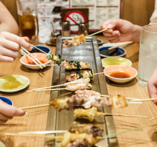 People enjoying traditional Japanese food in Kyoto