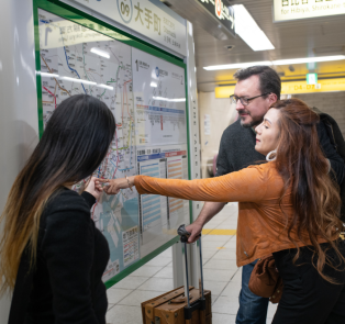 Tourists planning their day trip travel route, Japan