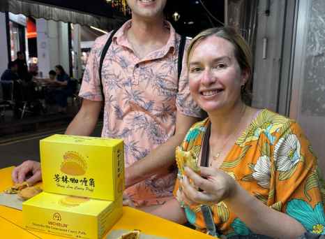 Kelia and companion enjoying their Singapore food day