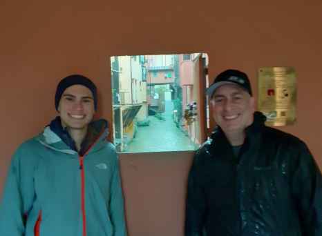 Through the Secret Window: A Rainy Glimpse into Bologna’s Hidden Canal