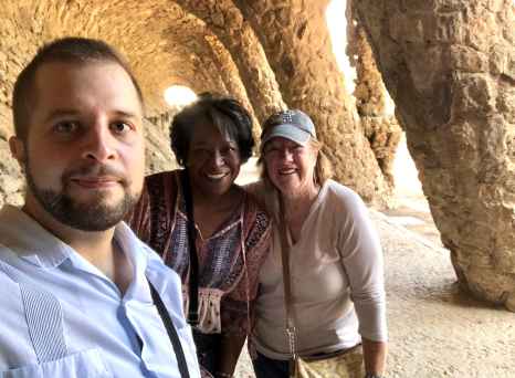 Smiles Beneath Iconic Spanish Arches