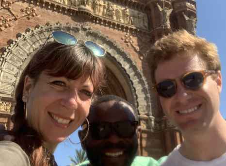 Smiles Beneath Iconic Spanish Arches