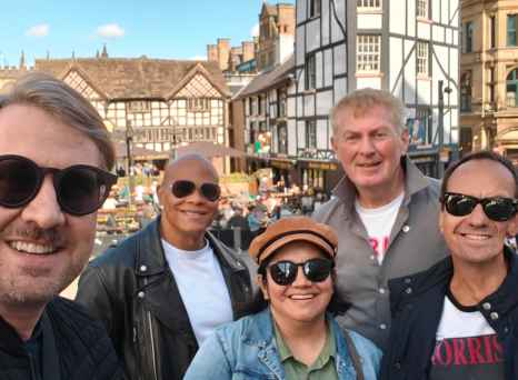 Sunlit Smiles in a Timeless Town Square