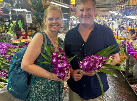 Exploring a flower market with vibrant colors in hand