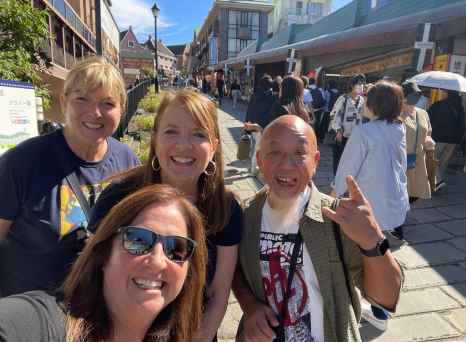 Sunlit Smiles on a Bustling Street