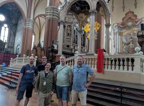 Sacred Smiles: Friends United Beneath Gothic Arches