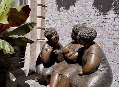 Whispers in Bronze: A Sunlit Conversation