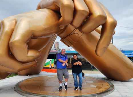 Joyful Encounter Beneath Brilliant Bronze