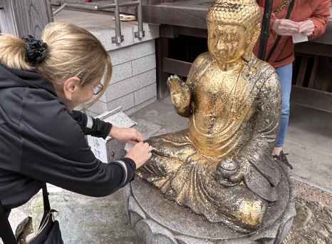 Golden Reverence: A Moment at the Shrine