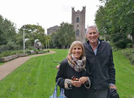 Couple standing in front of St. Audoen's Church, Dublin.