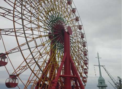 Ferris wheel beside Kobe Port Tower in Kobe, Japan.