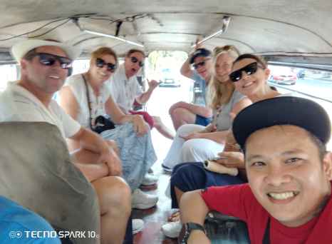 Laughter fills the air as friends ride together in Manila.