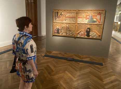 Admiring intricate medieval art in a quiet Santiago gallery.