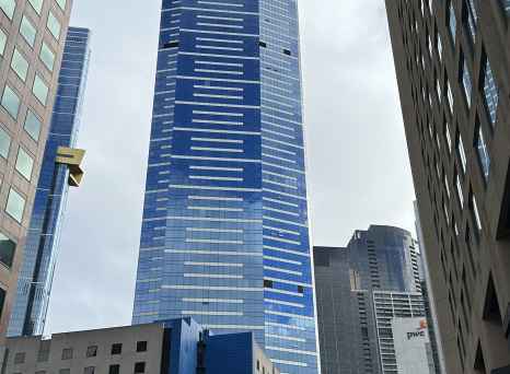 The Eureka Tower in Melbourne, visible between other skyscrapers.