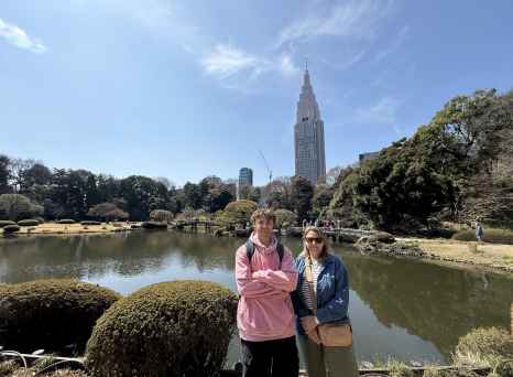 The NTT Docomo Yoyogi Building visible behind a pond.