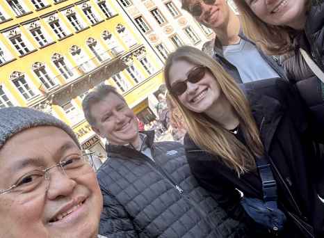 A joyous group captured against the colorful facades of Munich.