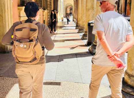 A casual walk reveals the timeless charm of Bologna's arches.