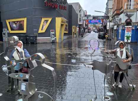 Amusing street sculptures brighten a rainy day in Hamburg.