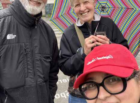 Enjoying a rainy Oslo day with smiles and stripes.