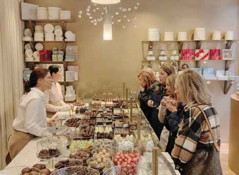 Decadent delights capture curious eyes inside a cozy Brussels shop.