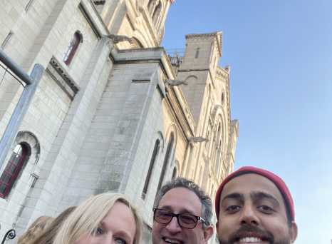 Sharing Smiles Beneath Iconic French Architecture