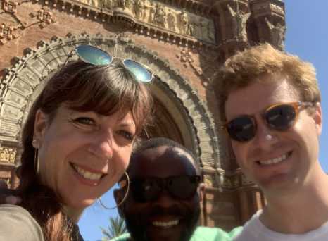 Smiles Beneath Iconic Arches