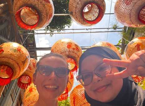 Joyful Smiles Under Vibrant Lanterns