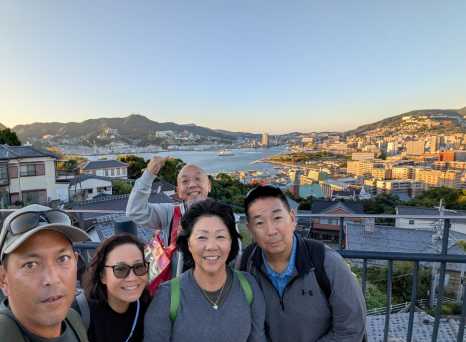 Embracing the View: A Family Moment Above the Bay