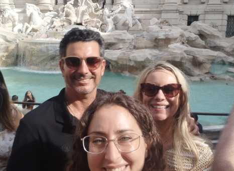 Sunlit Smiles by the Fountain of Wishes