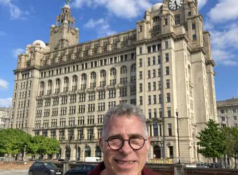 Smiles Beneath the Iconic Clock Tower
