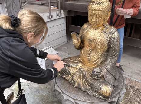 Golden Reverence: A Moment at the Shrine