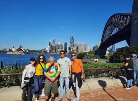 Sunlit Smiles by Sydney's Iconic Skyline