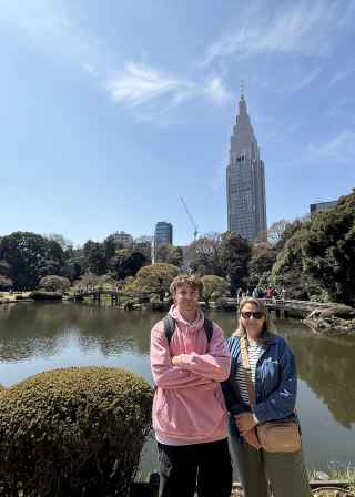 The NTT Docomo Yoyogi Building visible behind a pond.
