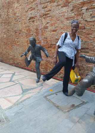 A playful moment with lively bronze statues in Singapore.