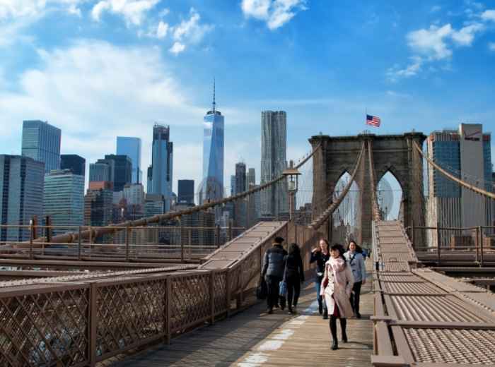 To walk across the Brooklyn Bridge 