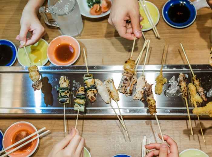 Travelers enjoying a multi course meal on a Kyoto food 