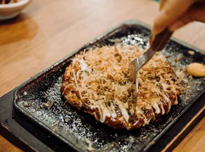 Okonomiyaki is a crispy and gooey Japanese specialty 