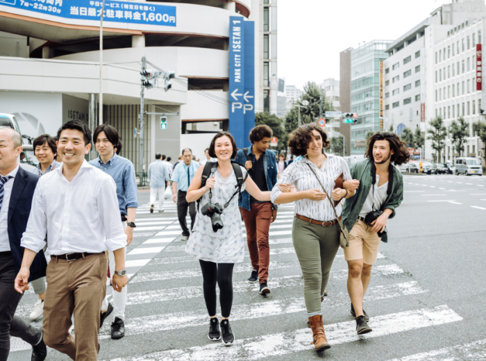 People walking across a pedestrian crossing