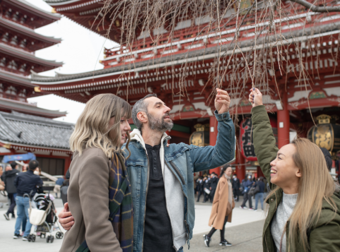 Private guide with travelers at Senso-Ji Temple, Japan
