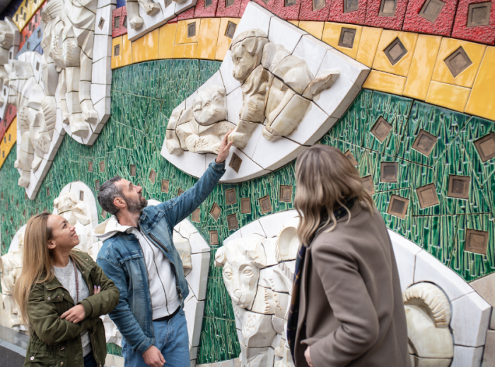 Couple admiring art with a local guide